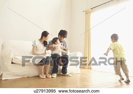 Family of Four in Living Room View Large Photo Image Stock Photography - Family of Four in Living Room. Fotosearch