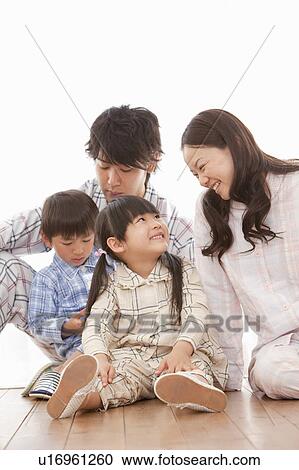 Stock Image - Family of Four in Pajamas. Fotosearch