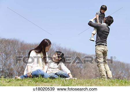 Stock Photo - Family of Four in Park. Fotosearch