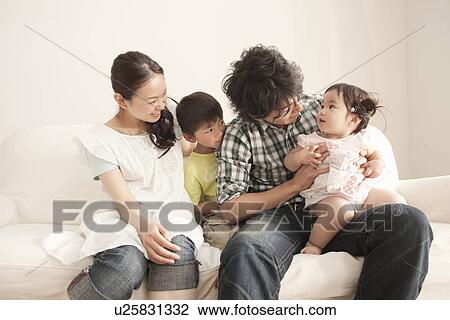 Family of Four on Sofa View Large Photo Image Stock Image - Family of Four on Sofa. Fotosearch