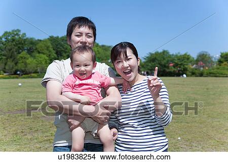 Picture - Family of Three in Park. Fotosearch