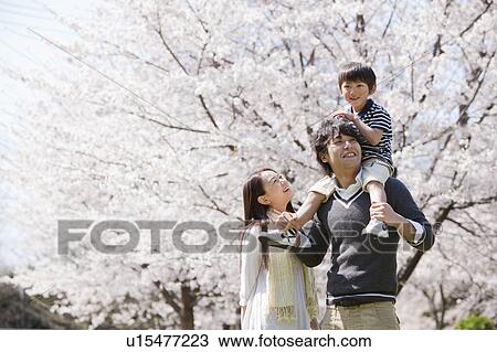 Family of Three, Son on Father's Shoulders View Large Photo Image Stock Image - Family of Three, Son on Father's Shoulders. Fotosearch