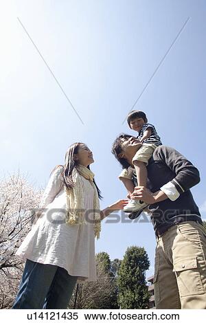 Family of Three, Son on Father's Shoulders View Large Photo Image Stock Photography - Family of Three, Son on Father's Shoulders. Fotosearch
