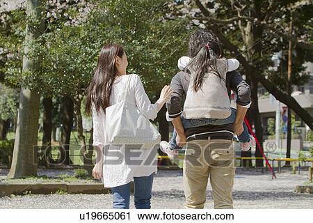 Stock Image - Family of Threei n Park. Fotosearch