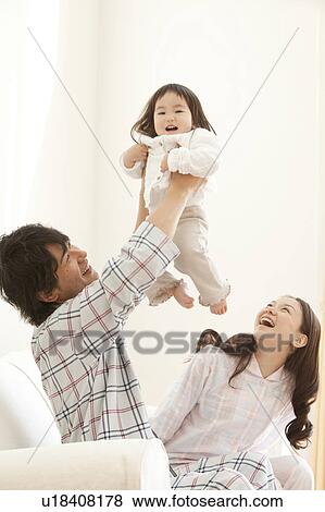 Father and Mother with Baby Girl View Large Photo Image Stock Photo - Father and Mother with Baby Girl. Fotosearch