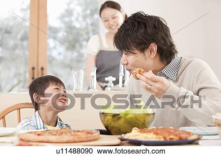 Father and Son Eating Pizza View Large Photo Image Stock Image - Father and Son Eating Pizza. Fotosearch