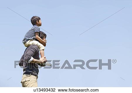 Father Carrying Son on Shoulders View Large Photo Image Stock Image - Father Carrying Son on Shoulders. Fotosearch