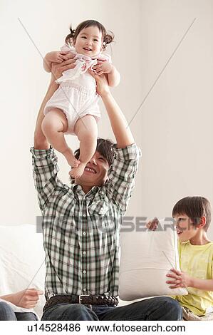 Father Holding Baby Girl Aloft View Large Photo Image Stock Photograph - Father Holding Baby Girl Aloft. Fotosearch