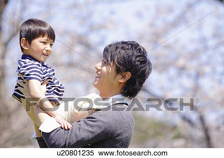 Stock Photography - Father Holding Son. Fotosearch