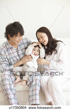 Father, Mother and Baby Girl in Pajamas View Large Photo Image Picture - Father, Mother and Baby Girl in Pajamas. Fotosearch