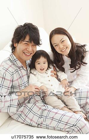 Stock Photography - Father, Mother and Baby Girl. Fotosearch