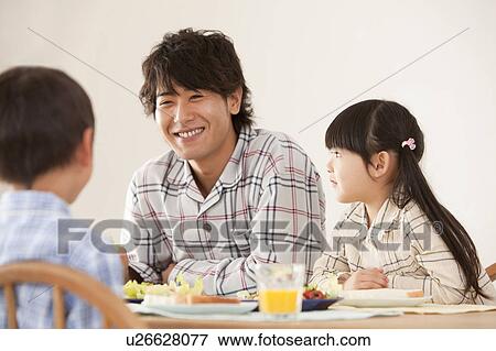 Father with Two Children at Breakfast Table View Large Photo Image Stock Photo - Father with Two Children at Breakfast Table. Fotosearch
