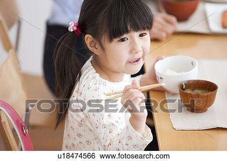 Girl (6-7) Having Breakfast View Large Photo Image Stock Photograph - Girl (6-7) Having Breakfast. Fotosearch