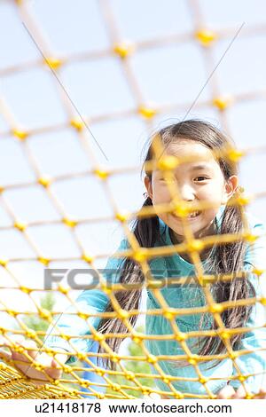 Stock Photo - Girl Playing in Playground. Fotosearch