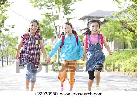 Stock Image - Girls Going to School. Fotosearch