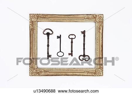Gold picture frame and antique keys View Large Photo Image Stock Photo - Gold picture frame and antique keys. Fotosearch