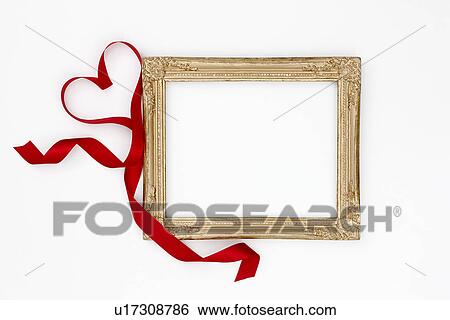Gold picture frame and red ribbon View Large Photo Image Stock Photograph - Gold picture frame and red ribbon. Fotosearch