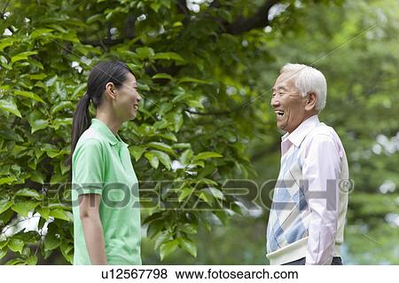 Stock Photo - Grandfather and Granddaughter Looking At Each Other. Fotosearch