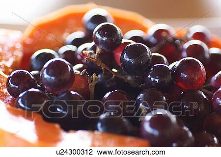 Stock Image - Grapes and Papaya. Fotosearch