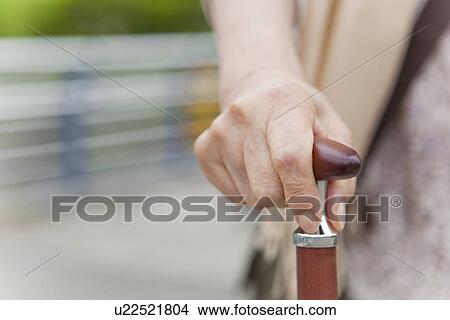 Picture - Hand on Walking Stick. Fotosearch