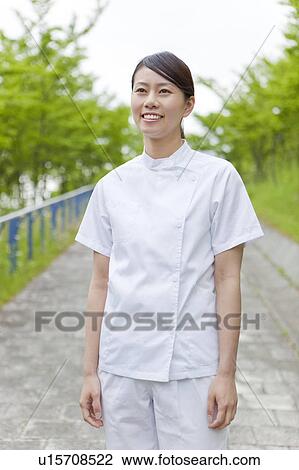 Healthcare worker standing, Kanagawa Prefecture, Honshu, Japan View Large Photo Image Stock Image - Healthcare worker standing, Kanagawa Prefecture, Honshu, Japan. Fotosearch