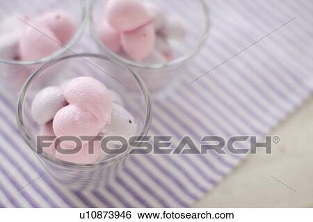 Stock Photograph - Heart shape meringue in glass. Fotosearch