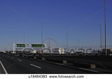 Stock Image - Highway with Ferris wheel, Koto ward, Tokyo Prefecture, Honshu, Japan. Fotosearch