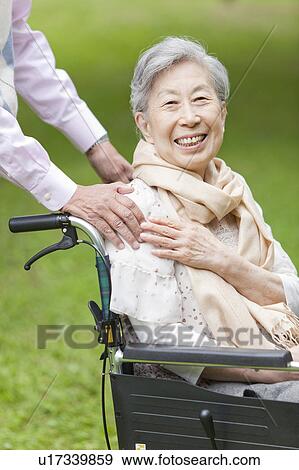 Husband's Hand on Senior Woman's Shoulder View Large Photo Image Stock Photo - Husband's Hand on Senior Woman's Shoulder. Fotosearch
