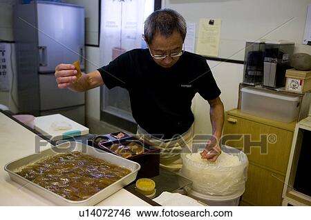 Stock Photograph - Mature man making Shima-sushi. Fotosearch