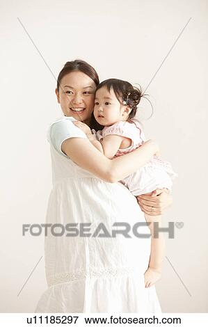 Mothe Holding Baby Girl View Large Photo Image Stock Photo - Mothe Holding Baby Girl. Fotosearch