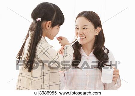 Mother and Daughter Brushing Teeth View Large Photo Image Stock Photography - Mother and Daughter Brushing Teeth. Fotosearch