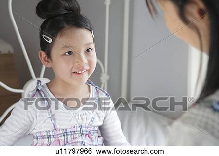 Stock Photograph - Mother and Daughter Talking. Fotosearch