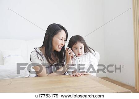 Mother and Daughter with Mobile Phone View Large Photo Image Stock Photo - Mother and Daughter with Mobile Phone. Fotosearch