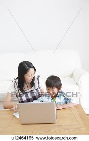 Stock Photography - Mother and Son Using Laptop. Fotosearch