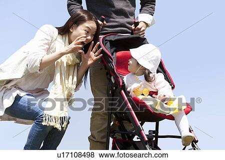 Mother Playing with Baby Girl View Large Photo Image Stock Photo - Mother Playing with Baby Girl. Fotosearch