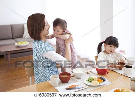 Mother with Two Children Having Breakfast View Large Photo Image Stock Photo - Mother with Two Children Having Breakfast. Fotosearch