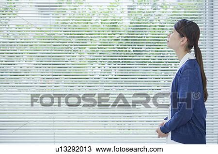 Stock Image - Nurse looking up, Kanagawa Prefecture, Honshu, Japan. Fotosearch