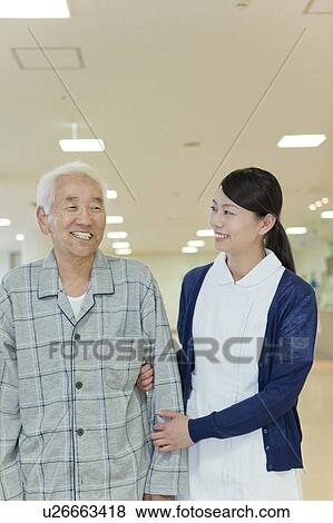 Nurse supporting a senior man, Kanagawa Prefecture, Honshu, Japan View Large Photo Image Stock Photo - Nurse supporting a senior man, Kanagawa Prefecture, Honshu, Japan. Fotosearch