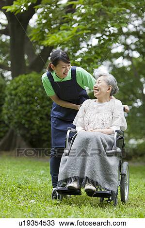 Nurse Talking to Senior Woman View Large Photo Image Stock Image - Nurse Talking to Senior Woman. Fotosearch