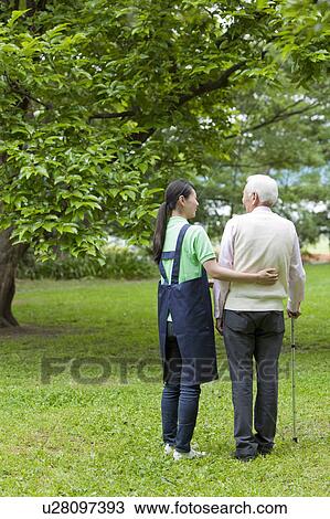 Nurse Walking with Senior Man View Large Photo Image Stock Image - Nurse Walking with Senior Man. Fotosearch