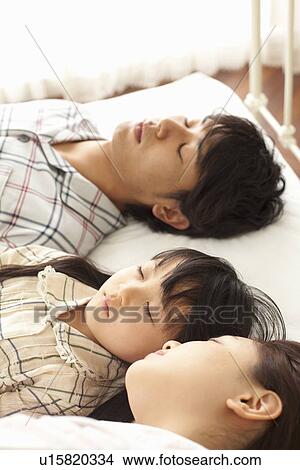 Parents and One Child Sleeping View Large Photo Image Picture - Parents and One Child Sleeping. Fotosearch