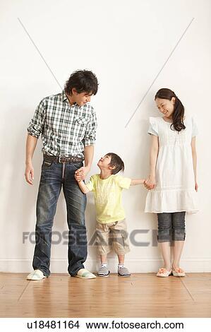 Parents and Son Holding Hands View Large Photo Image Picture - Parents and Son Holding Hands. Fotosearch
