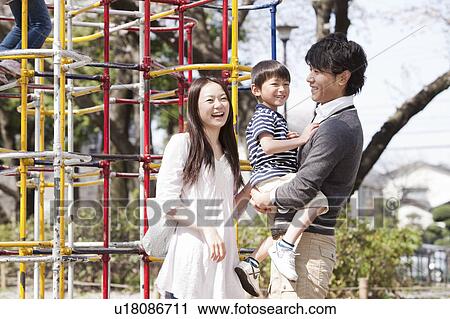 Parents and Son in Playground View Large Photo Image Stock Image - Parents and Son in Playground. Fotosearch