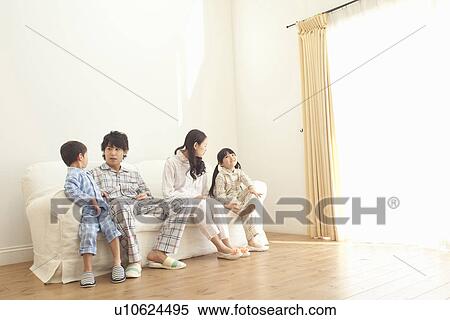 Parents, Daughter and Son on Sofa View Large Photo Image Stock Photography - Parents, Daughter and Son on Sofa. Fotosearch