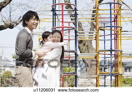 Parents with Baby Girl in Playground View Large Photo Image Stock Image - Parents with Baby Girl in Playground. Fotosearch