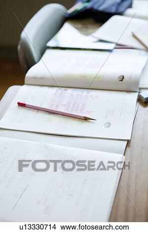 Pencil on Textbook View Large Photo Image Picture - Pencil on Textbook. Fotosearch
