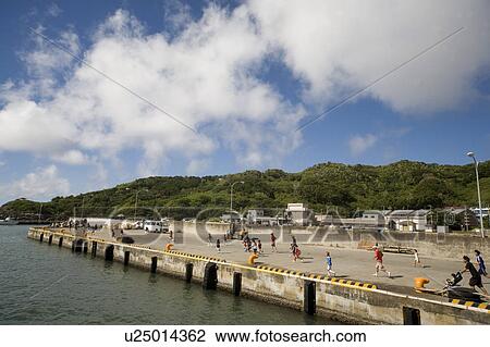 Stock Image - People Jogging at Harbour. Fotosearch