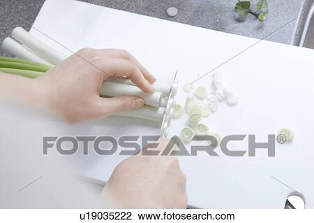 Stock Image - Person Chopping Leeks. Fotosearch