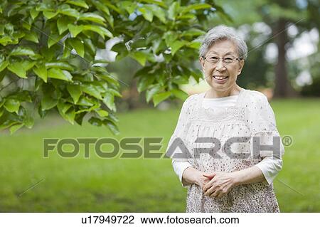 Stock Image - Portrait of a senior woman, Tokyo Prefecture, Honshu, Japan. Fotosearch