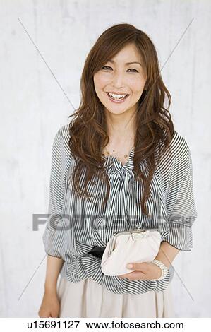 Stock Photo - Portrait of Mid Adult Woman. Fotosearch